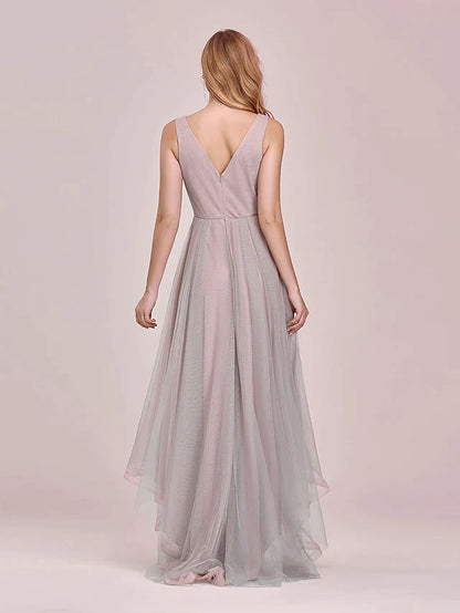 Close-up of the V-neck bodice and intricate floral appliques on the tulle bridesmaid dress.