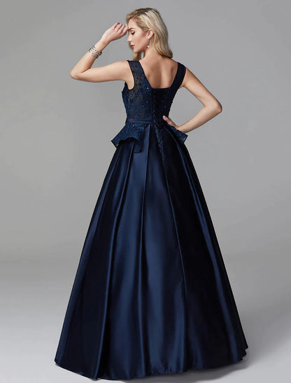 Close-up of the V-neckline and intricate lace on the ball gown.