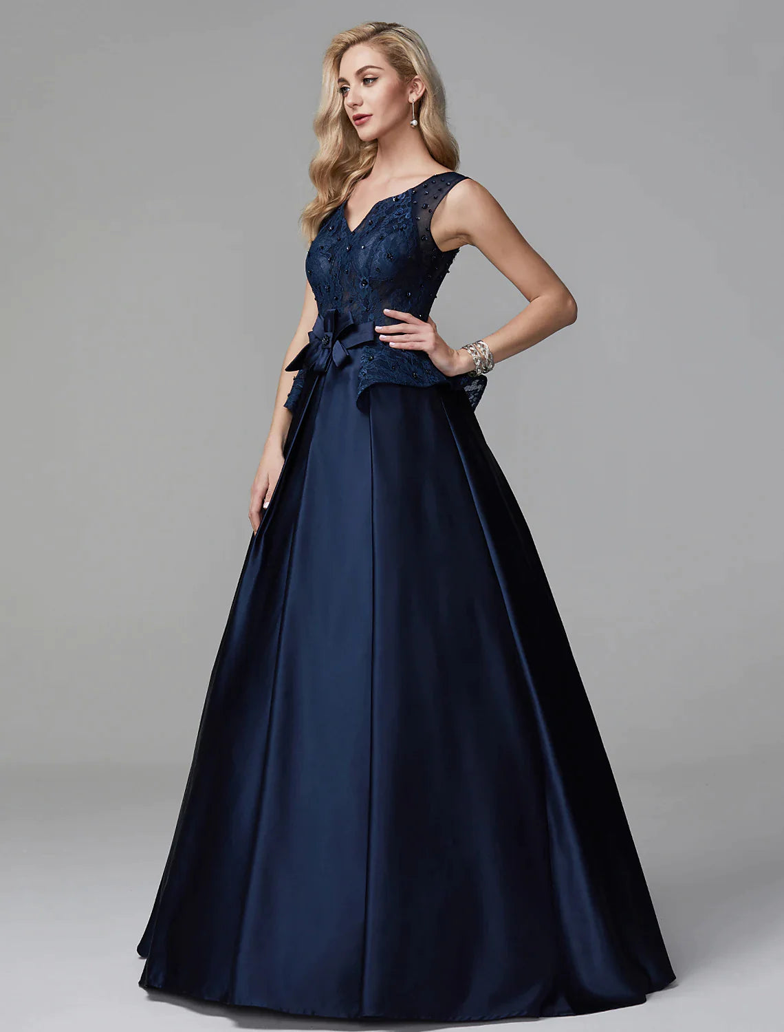 Back view of the ball gown, showcasing the floor-length skirt and train.