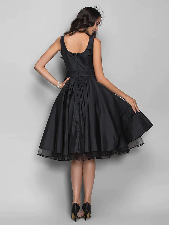 Back view of an elegant sleeveless ball gown dress, showing the full skirt.