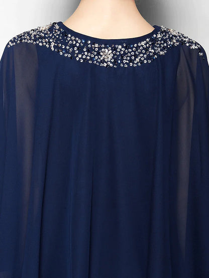 Detail of the 3/4 length sleeve and the chiffon fabric of the elegant dress.