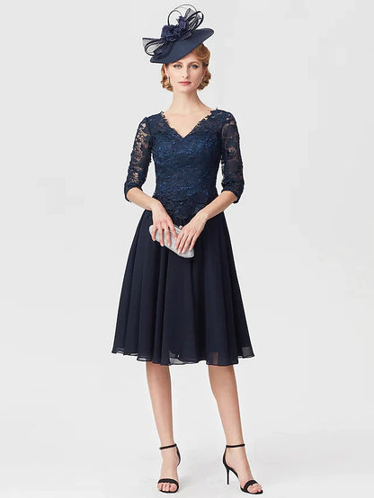 Woman wearing an elegant V-neck chiffon lace Mother of the Bride dress.