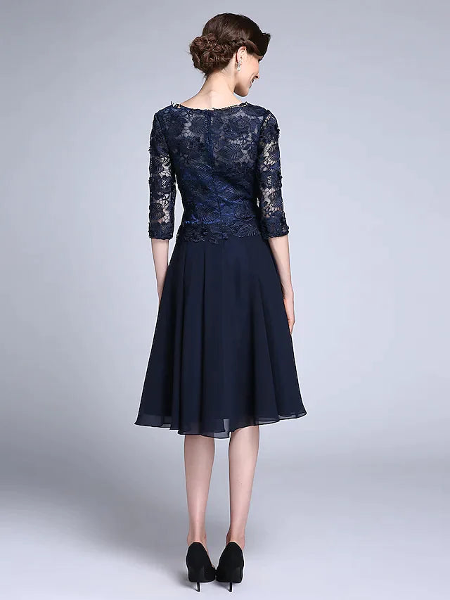 Full length view of the woman in the elegant V-neck chiffon dress.
