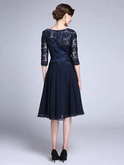 Full length view of the woman in the elegant V-neck chiffon dress.
