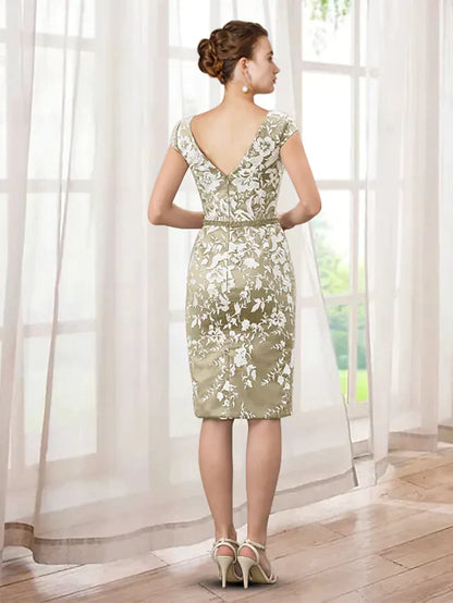 Close-up of the intricate lace and applique detail on the dress.