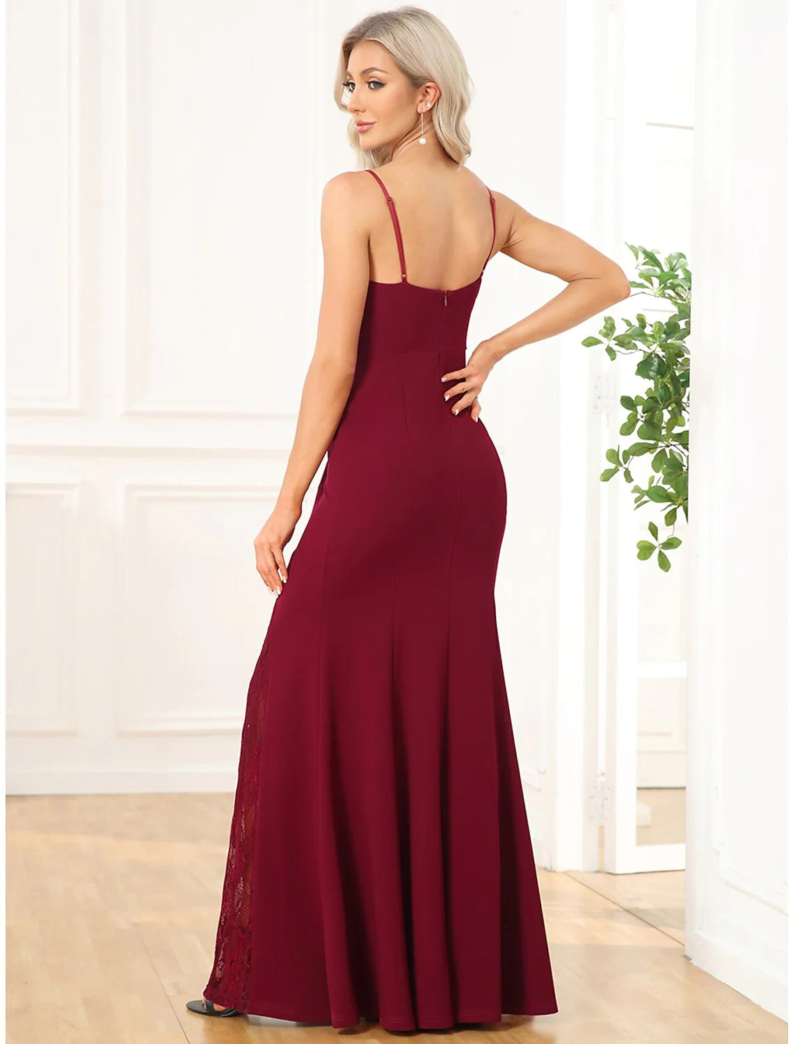 Back view of the mermaid trumpet evening gown showing embroidery detail.