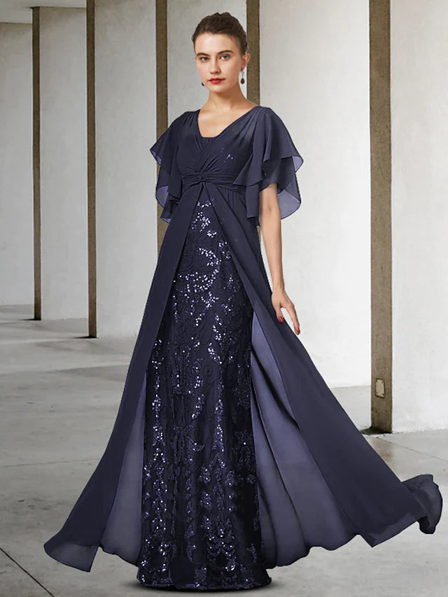 Woman wearing an elegant V-neck short sleeve lace sequined mother of the bride gown.