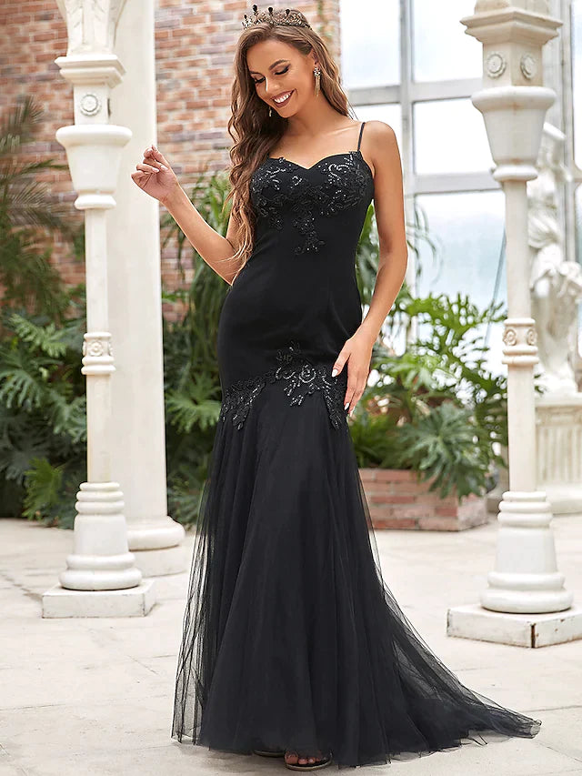 Side profile of the bride in the V-neck sequined wedding dress.