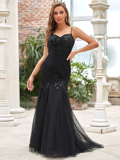 Model posing in the elegant V-neck tulle bridal gown.