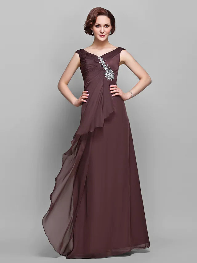Model wearing an elegant A-line V-neck chiffon Mother of the Bride dress with ruffles and side draping.