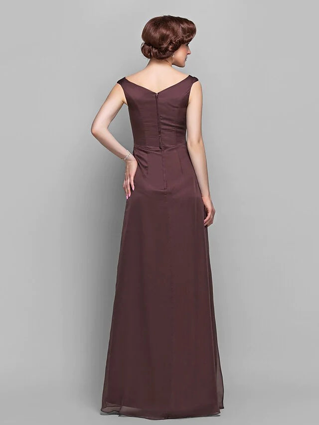 Side view of a model in a sleeveless A-line chiffon gown, highlighting the ruffles and draping.