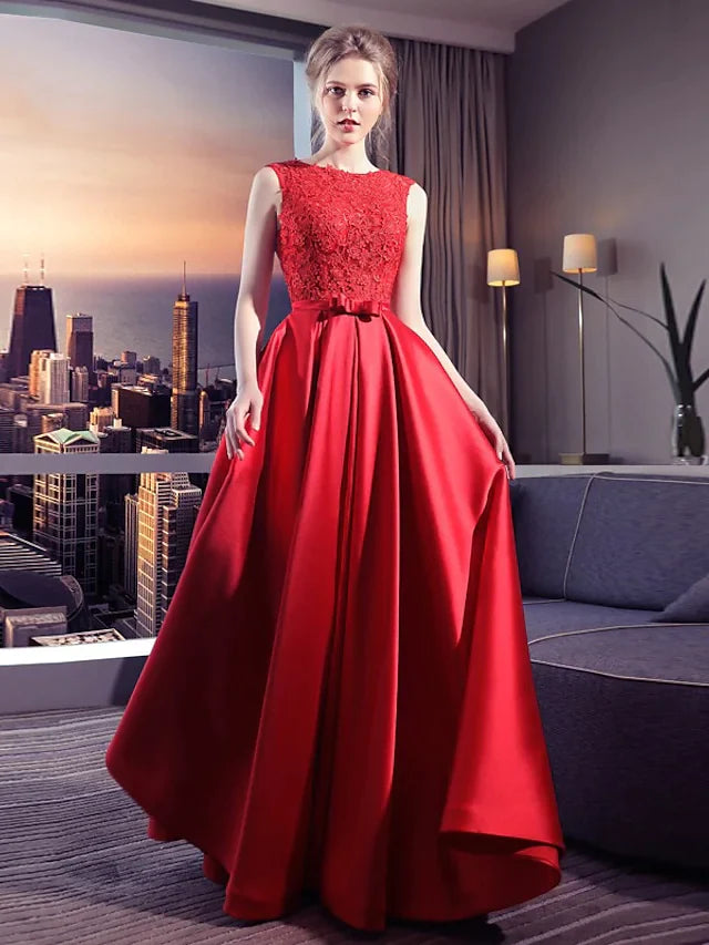 Front view of an elegant vintage jewel neck ball gown wedding dress with lace bows.