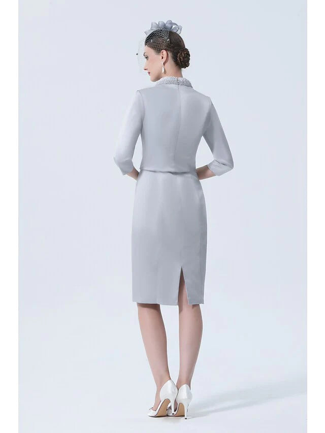 Side view of the elegant plus size mother of the bride dress, showing the knee-length satin skirt.