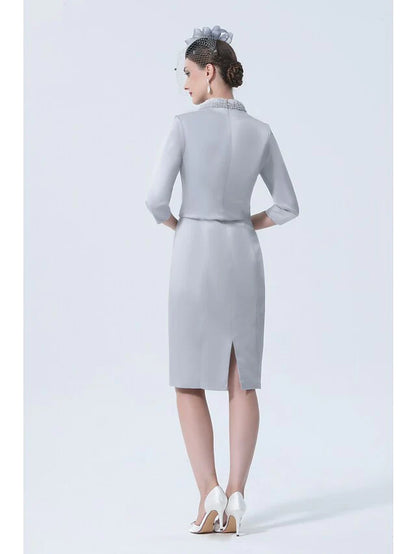 Side view of the elegant plus size mother of the bride dress, showing the knee-length satin skirt.