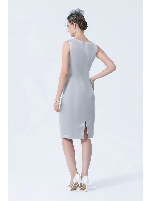 Plus size woman posing in the elegant vintage high neck satin mother of the bride dress.
