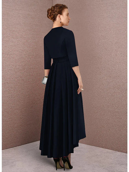 Woman posing gracefully in the teal mother of the bride dress, showcasing its full silhouette.