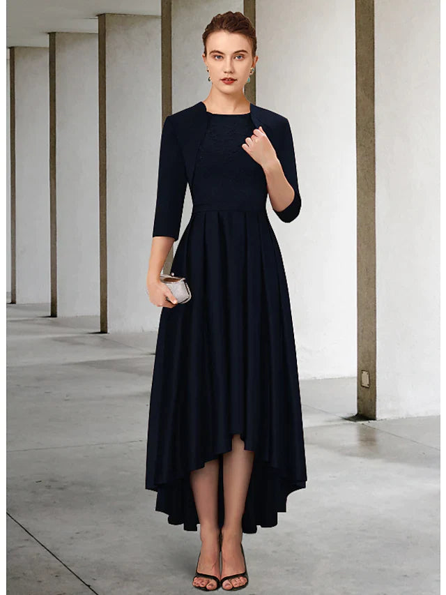 Another angle of the woman in the teal dress, emphasizing the elegant drape and vintage style.