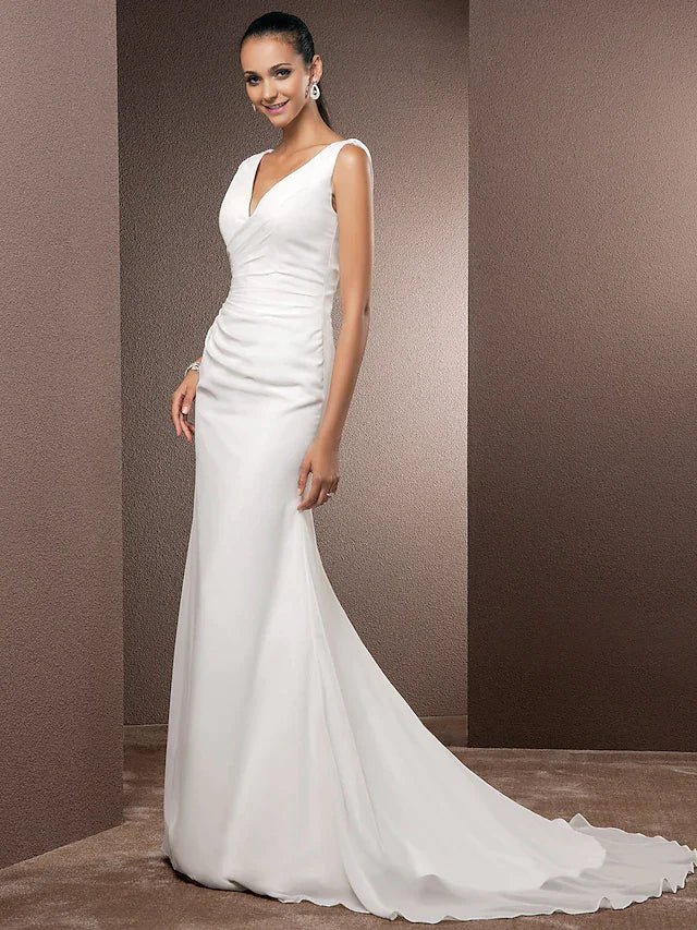 Close-up of the V-neckline and regular straps on the wedding dress.