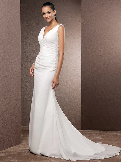 Close-up of the V-neckline and regular straps on the wedding dress.