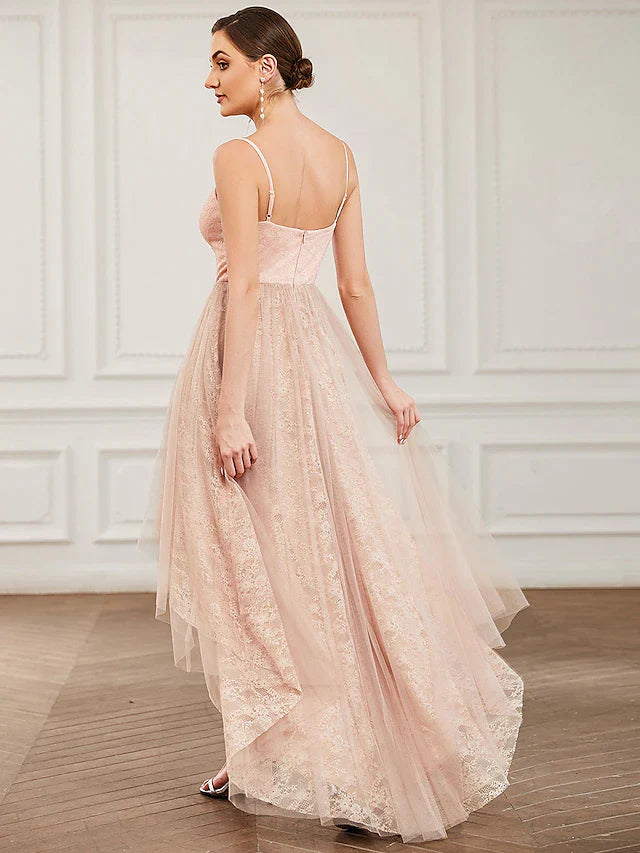Side view of the white A-line homecoming dress, highlighting the tiered skirt and asymmetrical design.