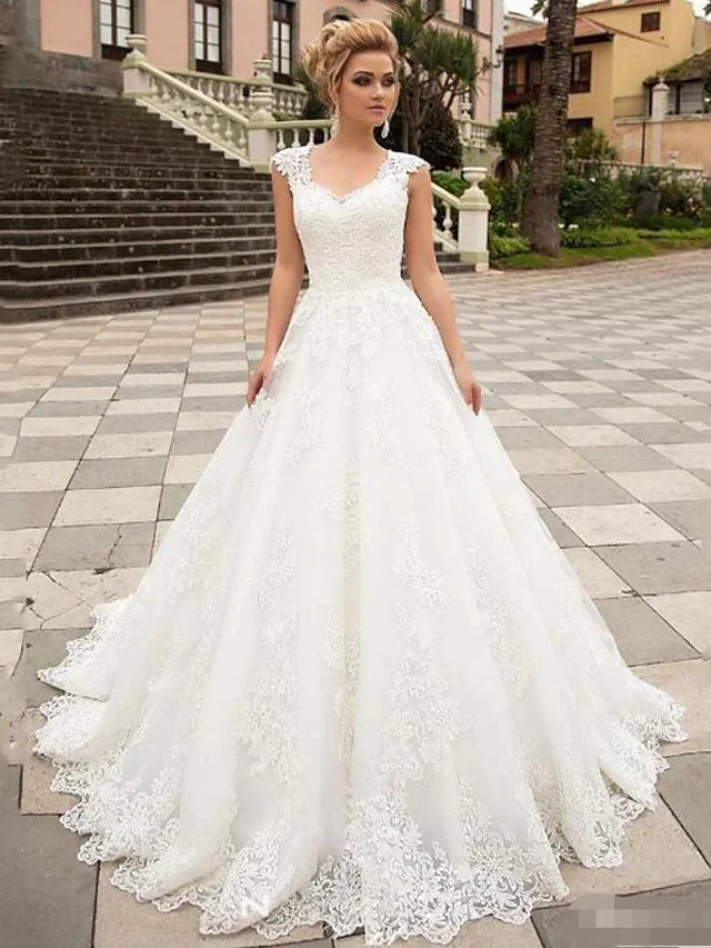 White lace V-neck cap sleeve ball gown wedding dress, front view.