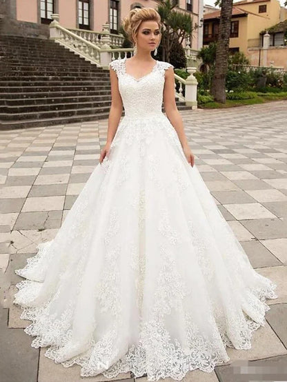 White lace V-neck cap sleeve ball gown wedding dress, front view.