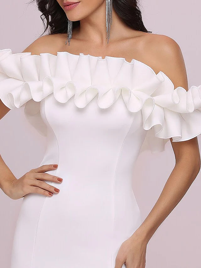 Close-up of the white off-shoulder ruffled mermaid dress fabric and ruffle detail.