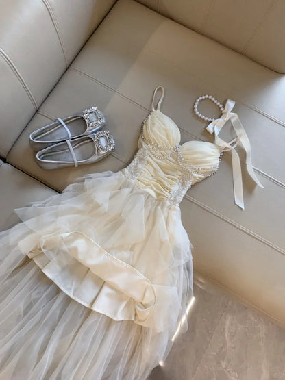 Elegant A-Line Sweetheart Pearl Ruffled Tulle Champagne High-Low Homecoming Dress