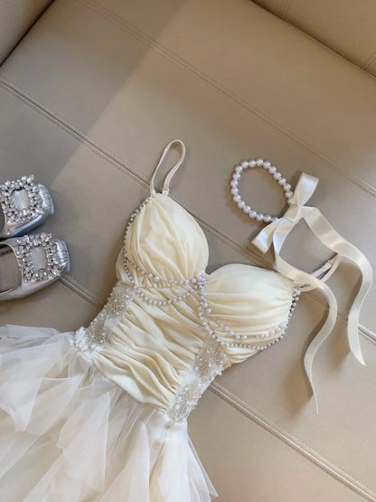 Elegant A-Line Sweetheart Pearl Ruffled Tulle Champagne High-Low Homecoming Dress
