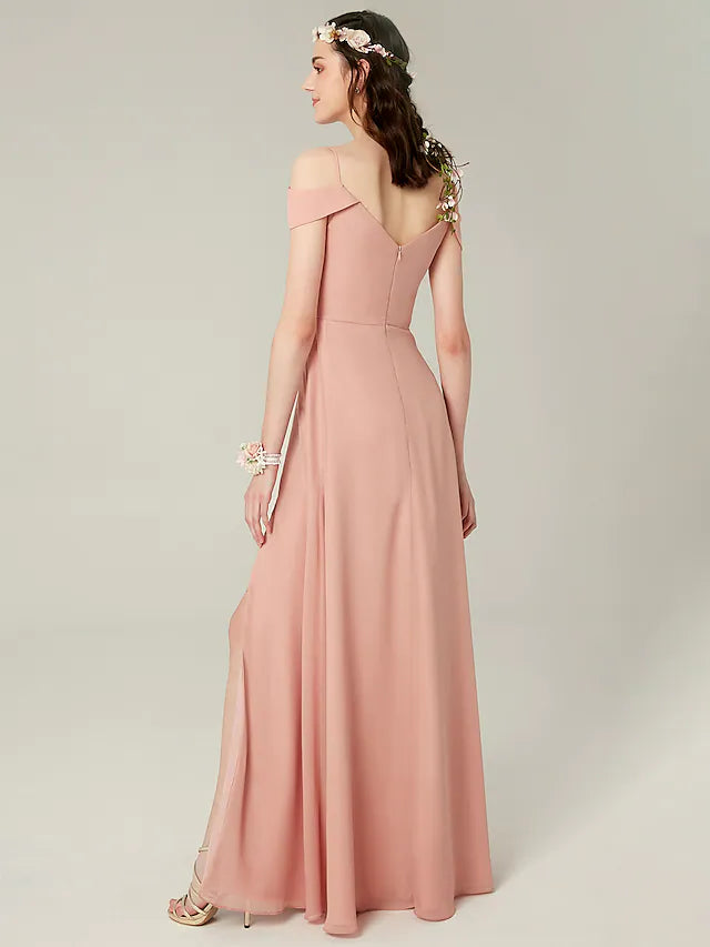 Side view of a woman in an A-line spaghetti strap chiffon gown, showing the elegant drape.