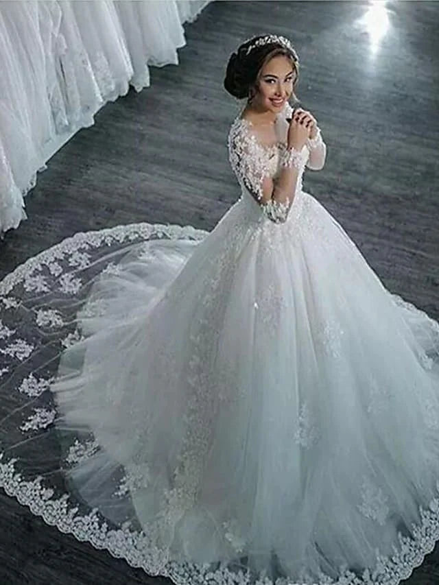 Front view of A-line wedding dress with high neck, lace long sleeves, and court train.