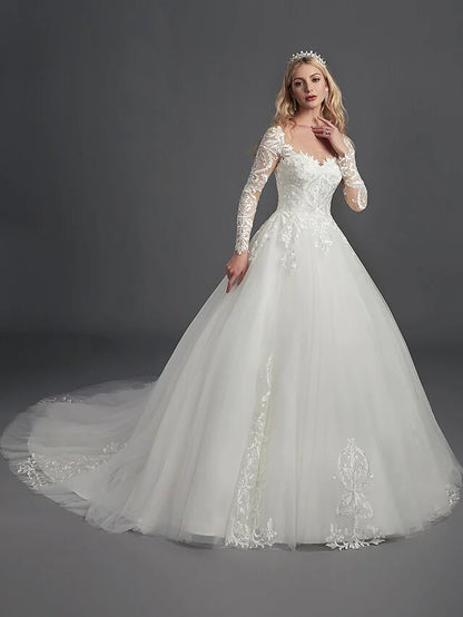 Close-up of the illusion neckline and bodice of the wedding dress, featuring intricate lace patterns.