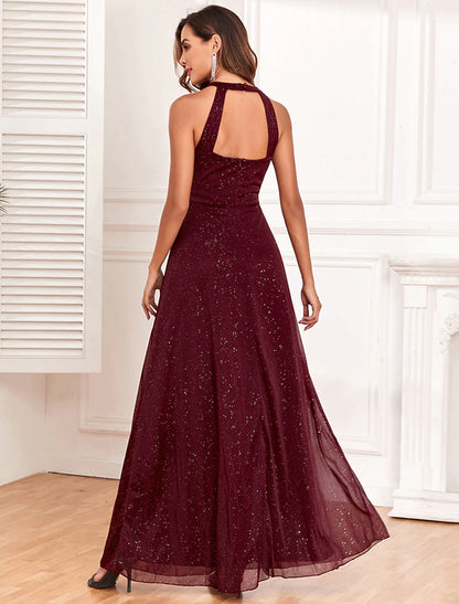 Close-up of the glitter fabric and elegant halter neckline of the evening dress.