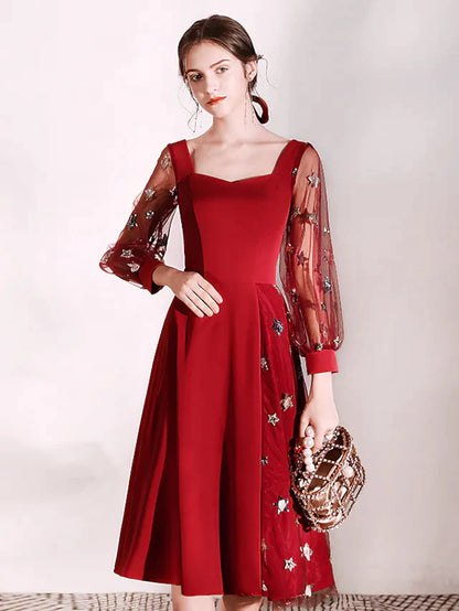 Back view of the elegant long sleeve A-line party dress.