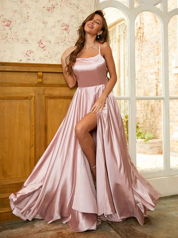 Side profile of the sleeveless light blue A-line prom dress with spaghetti straps.
