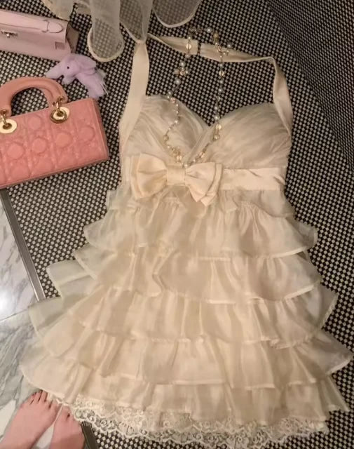 Lovely A-Line Halter Tiered Ruffle Bow-Accented Cream Mini Homecoming Dress
