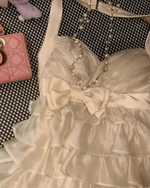 Lovely A-Line Halter Tiered Ruffle Bow-Accented Cream Mini Homecoming Dress