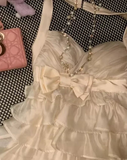 Lovely A-Line Halter Tiered Ruffle Bow-Accented Cream Mini Homecoming Dress