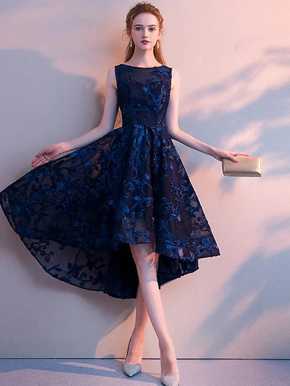 Woman wearing an elegant A-line jewel neck sleeveless cocktail dress made of tulle.