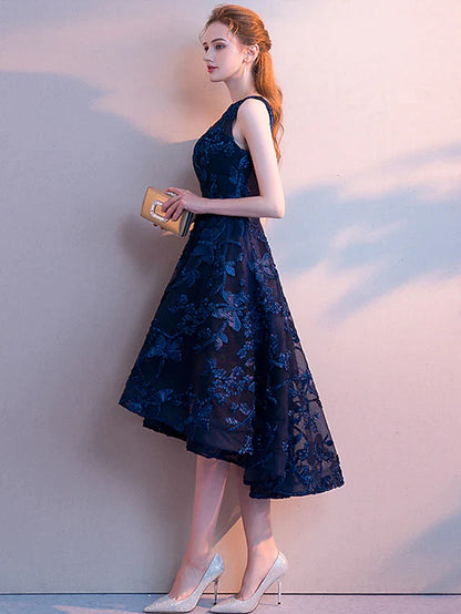 Back view of the elegant sleeveless A-line dress, highlighting the tulle fabric and pleats.