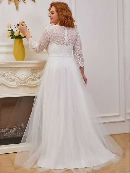 Side view of the A-line lace tulle wedding dress with floor-length cascading ruffles.