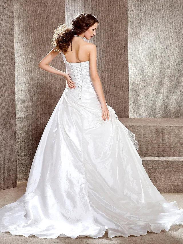 Back view of the A-line wedding dress, highlighting the one-shoulder design and train.