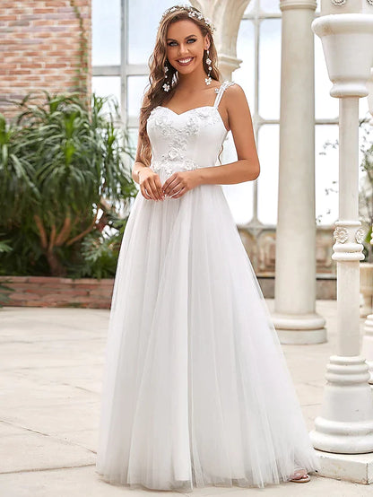 Back view of a floor-length wedding dress, showcasing the lace detailing and elegant train.