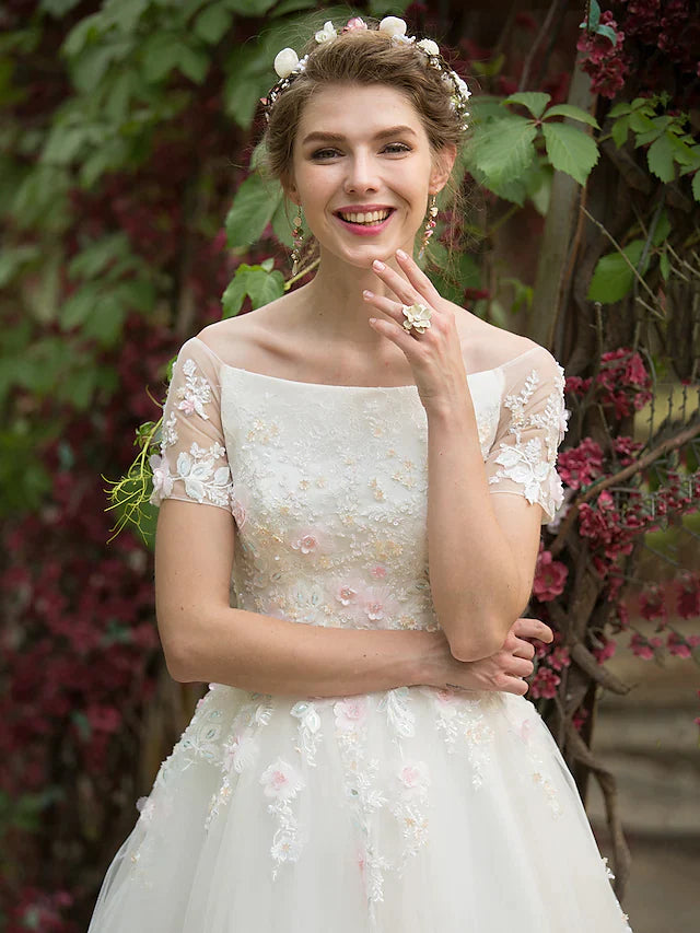 Full view of the A-line wedding dress, showcasing its floor-length tulle skirt.