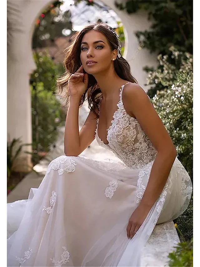 Close-up of lace and applique details on the A-line wedding dress bodice.