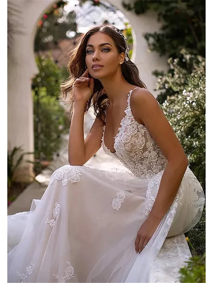 Close-up of lace and applique details on the A-line wedding dress bodice.