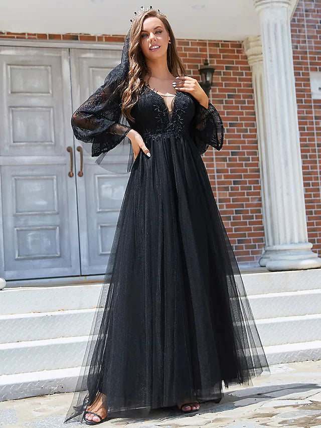 Side view of the black A-line wedding dress, highlighting the flowing tulle skirt and elegant draping.