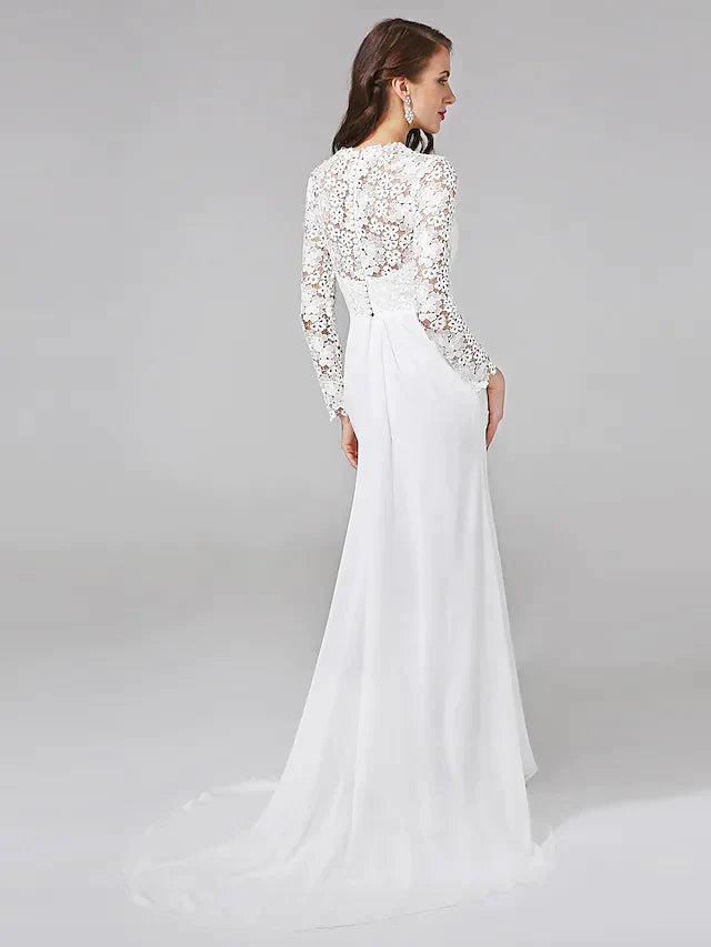 Close-up of the V-neckline and intricate floral lace on the long illusion sleeves of the wedding dress.