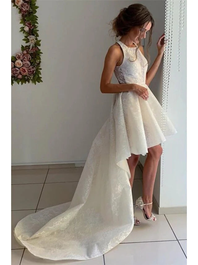 Close-up of lace appliques and jewel neck detail on the wedding dress.