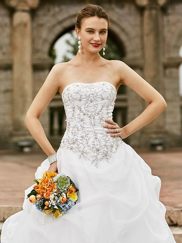Side profile of the organza ball gown, highlighting the unique pick-up skirt.